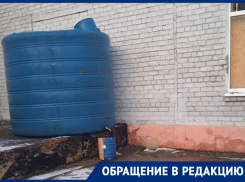 Тьма, выбоины и бочка по расписанию: Админпоселок в Донецке остался без воды, дорог и освещения